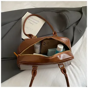 Internal view of the brown vintage Boston bag showing large capacity for daily items