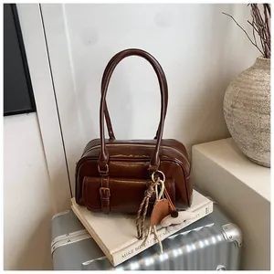 Vintage dark brown faux leather underarm shoulder bag with front buckle pocket and plush charm
