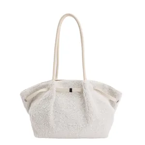 Minimalist beige fuzzy faux shearling tote bag for women with leather straps