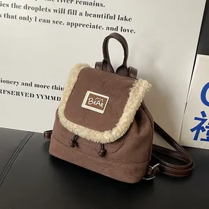 Mini brown faux suede backpack with plush fleece trim and bear patch detail