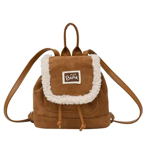 Mini brown suede backpack with white plush trim and bear patch for daily commuting