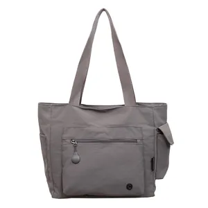 Minimalist grey large capacity nylon tote bag with multiple pockets and top handles