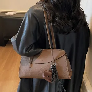 Minimalist dark brown litchi grain leather tote bag with stylish mini pouch attachment