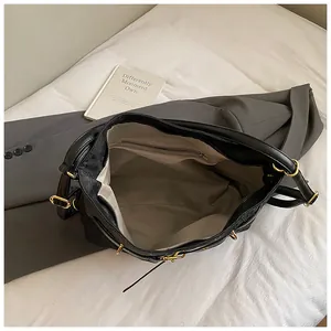 Top view of large black crocodile tote bag showing spacious interior and zipper pocket