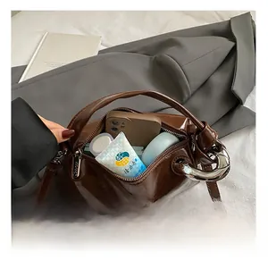 Detail showing the large interior capacity of this vintage dark brown leather boston bag