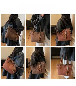 Detailed views of dark brown embossed tote bag with drawstring and plush bear charm