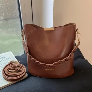 Women's Vintage PU Leather Bucket Bag With Braided Handle Fashion Crossbody Shoulder Bag With Rabbit Charm Daily Purse