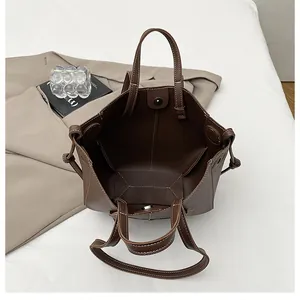 Deep coffee litchi grain tote bag showing interior space and white contrast stitching