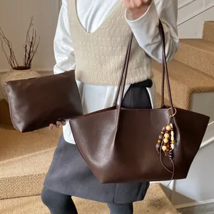 Vintage dark brown leather tote bag with small pouch and wood bead tassel charm