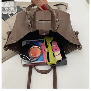 Detailed interior of the brown pebbled leather tote bag showing high storage capacity