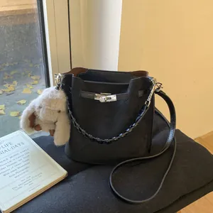 Women Retro Matte PU Leather Bucket Bag Minimalist Braided Handle Shoulder Crossbody Bag With Rabbit Plush Pendant