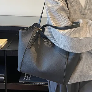 Chic large capacity pebbled leather tote bag for women shown in a modern lifestyle commute setting