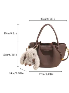 Detail view of coffee pleated bucket bag dimensions and lychee grain leather texture