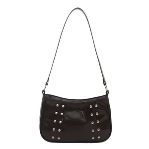 Retro brown crossbody bag with silver stud rivets and a polished finish look