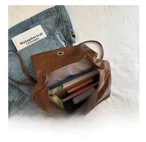 Internal capacity of the vintage brown faux leather tote bag with daily items