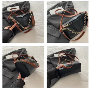 Detail view of black cylinder crossbody bag with golden flower chain from four angles