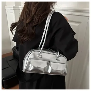 Silver metallic bowling bag with dual front pockets and glossy mirror finish detail