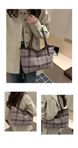 Détail du sac cabas en laine à carreaux gris avec anses en cuir brun et rivets dorés