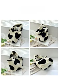 Detailed views of heart pattern plush bucket bag showing front, side, and bottom structure