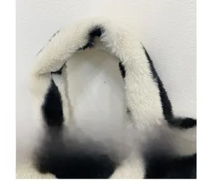 Close-up of comfortable black and white faux fur bucket bag handle detail