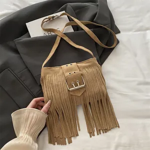 Retro bohemian camel faux suede crossbody bag with long fringes and metal buckle detail