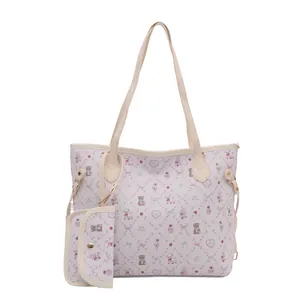 Cartoon pattern tote bag set with cream handles and golden hardware on white background