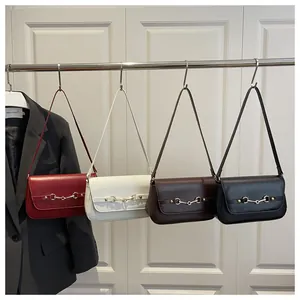Collection of retro shoulder bags in red, white, coffee, and black with metal buckle detail