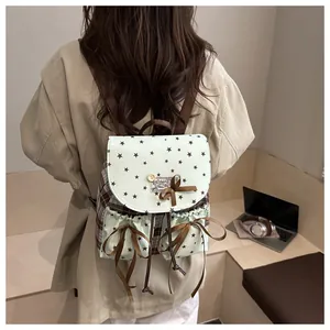 Rear view of a vintage Morigirl style backpack with lace bows and star pattern