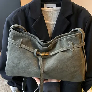 Gray-green matte leather tote bag with gold buckle and shoulder strap for women
