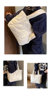 Detail view of quilted puffer tote bag showing wave stitching texture and large capacity