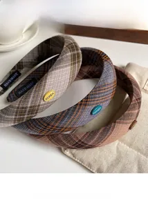Detail of plaid headbands with woven texture, handmade tags, and chic Korean style