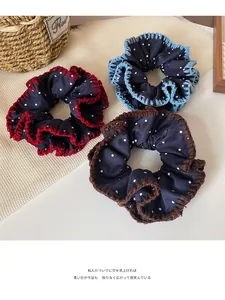 Three-piece denim blue scrunchie set with white polka dots and colorful crochet edges