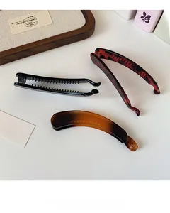 Lot de trois pinces à cheveux banane en noir mat, écaille et dégradés d'ambre