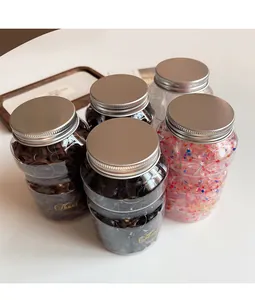 Five jars of high elasticity hair bands in varied colors with elegant silver lids