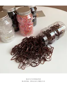 Detail of disposable high elasticity hair ties set in a jar with metal screw lid