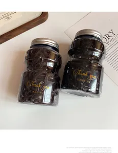 Two jars of durable high-elastic coffee hair ties with elegant gold lettering
