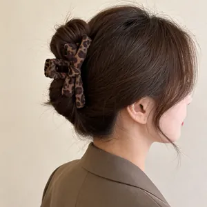 Large leopard print bow hair claw clip for women's stylish winter hair styling