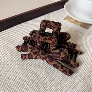 Elegant leopard print fabric bow hair claw clip for women's daily hair styling