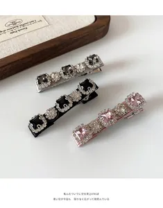 Detailed close-up of a 3-piece set of luxury crystal bow hair clips with glitter rhinestones
