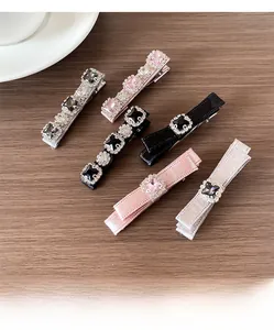 Detailed view of elegant bow hair clips with rhinestones on a wooden background