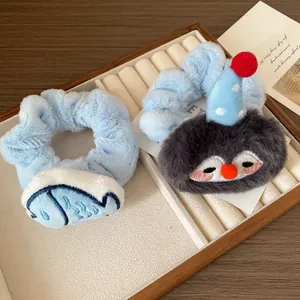 Cute plush penguin and fish embroidery hair scrunchies set in soft light blue faux fur