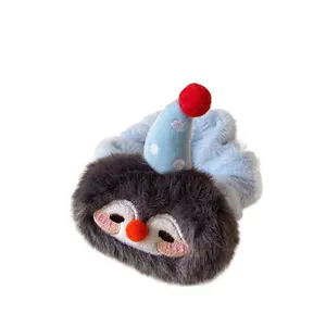 Cute plush penguin scrunchie in light blue and grey with embroidered cartoon details