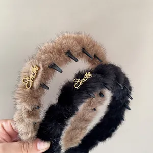 Cerchietti in peluche leopardato marrone e nero con dettaglio Smile in metallo dorato