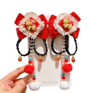 Traditional Chinese New Year red bow hair clips with plush balls and pearl tassels