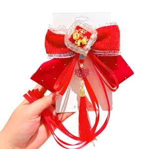 Red velvet bow hair clip for girls with festive tassels and Chinese style ornaments