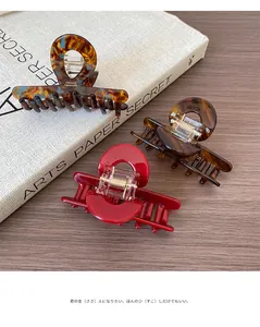 Set of three acetate hair claws in tortoiseshell and red with France handmade engraving
