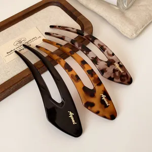 Three-piece acetate U-shaped hair pins set with gold logo in black and tortoise patterns