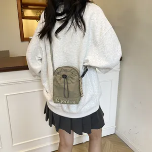 Japanese style olive green drawstring crossbody bag with adjustable strap for women