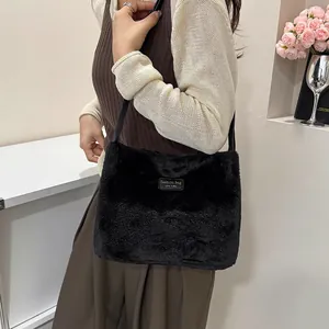 Chic black faux fur tote bag with a New York label, perfect for winter shoulder wear