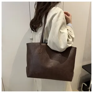 Model wearing a large capacity deep brown vintage leather tote bag for commuting